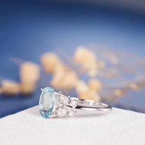 Vintage silver butterfly ring with oval blue topaz and sparkling accent stones