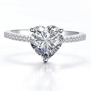 Sparkling heart-shaped zircon ring with pavé side stones on a silver polished band