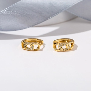 Macro shot of 18K gold plated chain link earrings featuring micro-pave cubic zirconia
