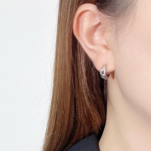 Elegant 18K gold plated hollow chain link hoop earrings on female model's ear