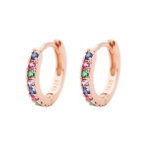 Detailed close-up of S925 rose gold huggie hoop earrings with rainbow colored stones