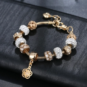 Golden charm bracelet with white rhinestones and flower pendant on snake chain