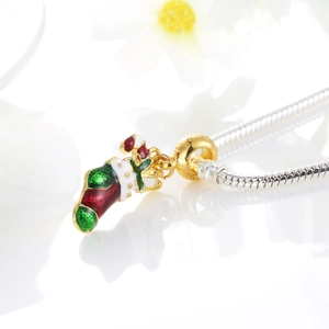 Christmas stocking and candy cane charm with red green enamel on a golden bead