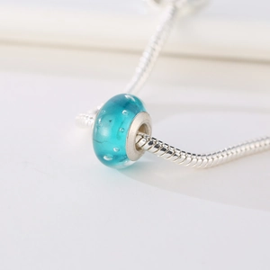 Light blue bubble glass charm bead on a silver snake chain for DIY jewelry making