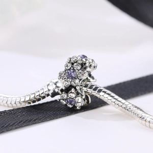 Romantic silver cherry blossom charm with purple rhinestones on a snake chain bracelet