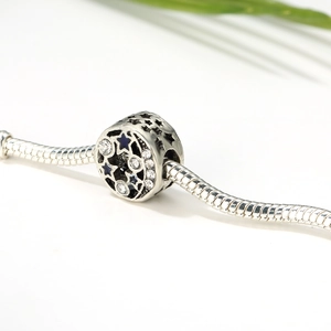 Bohemian silver charm with hollow stars and blue celestial stones on snake chain