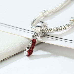 Silver charm necklace with a red enamel high heel pendant and a white pearl accent
