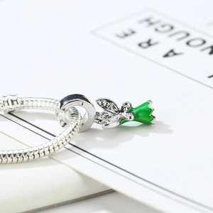 Silver snake chain bracelet with green lily of the valley and butterfly charm