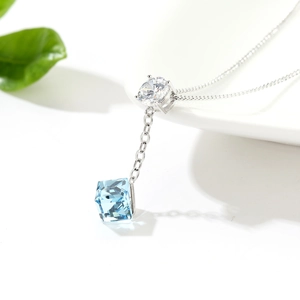 Minimalist silver necklace with aurora blue cube crystal and round zircon pendant