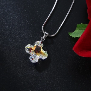 Austrian crystal cross pendant necklace with amber yellow facets on a silver snake chain