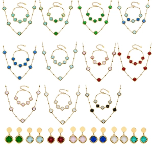 Elegant geometric clover jewelry set with faceted glass stones in multiple colors