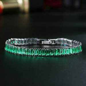 Classic silver tennis bracelet with emerald green rectangular zircon stones and claw setting