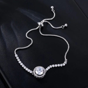 Close-up of adjustable silver bolo bracelet featuring a sparkling round crystal center