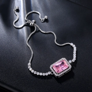 Macro shot of a rectangular pink zircon bracelet with a sliding bead adjustment clasp