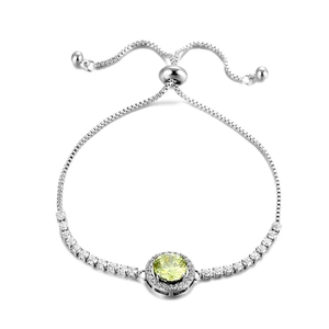 Detail of adjustable box chain bracelet featuring a halo-set lime yellow gemstone