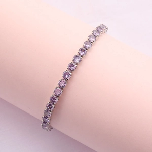 Micro-paved purple cubic zirconia tennis bracelet in silver-tone finish and 4-prong setting