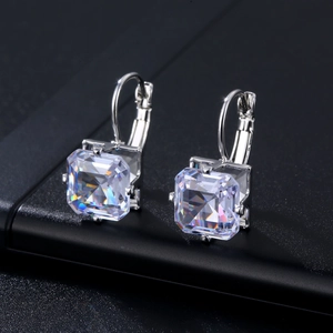 Sparkling square-cut cubic zirconia earrings with silver lever-back hooks on black background