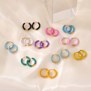 Colorful enamel huggie earrings set in 11 pairs of vibrant finishes and gold plating