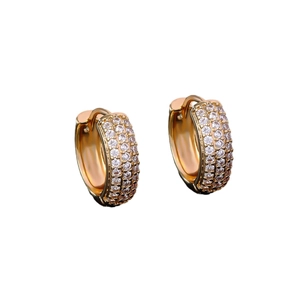 Iced out gold huggie hoop earrings with three rows of micro-paved cubic zirconia