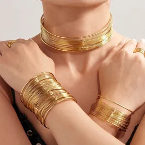 Golden multi-layer wire jewelry set featuring a choker necklace, bracelets, and rings