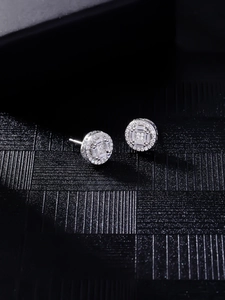Macro shot of silver hip hop stud earrings with halo setting and zircon stones