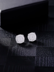 Macro shot of silver hip hop stud earrings encrusted with sparkling zircon stones