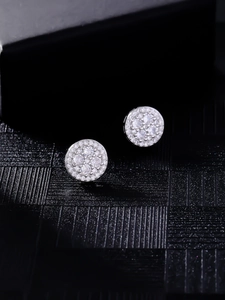 Close-up of hip-hop silver stud earrings with full micro-pave round cubic zirconia stones