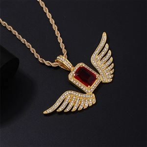 Hip-hop gold-plated winged necklace with large ruby-red stone and iced-out crystals