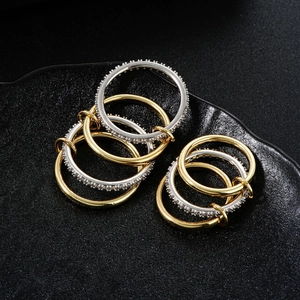 Stacked mix-metal ring set with gold and silver bands and micro-pave white zircons
