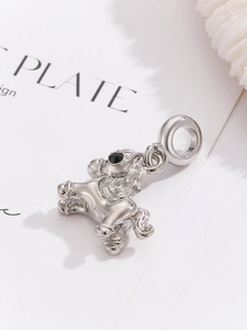 Close-up of a silver unicorn horse pendant with a black gem eye for DIY bracelets