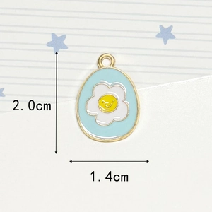 Macro shot of egg-shaped enamel pendant with smiley flower and 2.0cm size dimensions