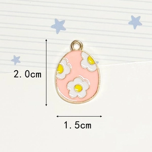 Detailed macro view of pink enamel Easter egg charm with gold trim and size dimensions