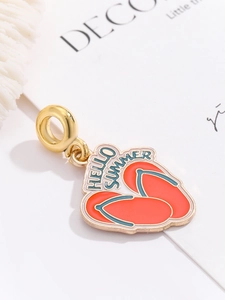 Detail shot of orange enamel flip-flop pendant with Hello Summer text on gold metal ring