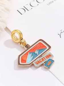 Macro view of vacation signpost charm with sun and mountain motifs for travel bracelets