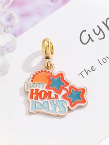 Detailed close-up of golden Happy Holidays pendant with colorful sun and stars icons