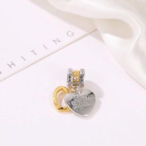 Two-tone gold and silver heart charm pendant with inspirational engraving and small zircons