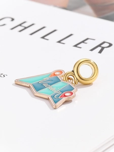 Detailed view of map-shaped enamel charm with Vacation lettering for DIY jewelry
