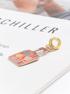 Detail of travel suitcase charm with colorful enamel inlays and golden ring for bracelets