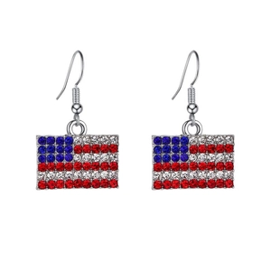 Close-up of USA flag earrings featuring red, white, and blue rhinestones on a silver base