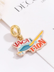 Detail of colorful airplane charm with Vacation lettering for DIY charm bracelets