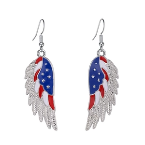 Detail of wing-shaped earrings with American flag pattern and star detail on silver metal