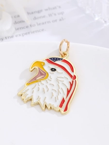 Detailed view of an eagle head charm with American flag motifs and golden ring clasp