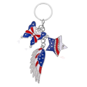 Detail of red white and blue enamel butterfly star and wing pendants on a silver keychain