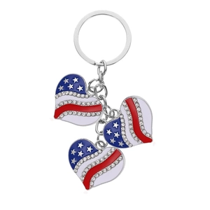 Close-up of triple heart keychain with American flag patterns and sparkling rhinestones
