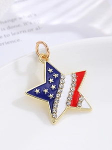 Macro shot of star pendant with US flag enamel colors and white sparkling rhinestones