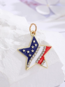 Macro shot of a star-shaped American flag pendant with sparkling rhinestones and gold edges