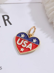 Detail of heart-shaped USA flag pendant with red, white, and blue enamel and gold trim