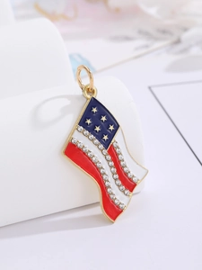 Macro view of wave-shaped USA flag pendant with gold plating and sparkling rhinestones
