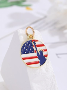 Detail of USA flag and Statue of Liberty heart pendant with red, white, blue enamel