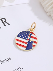 Detailed macro view of a round American flag pendant with Statue of Liberty silhouette
